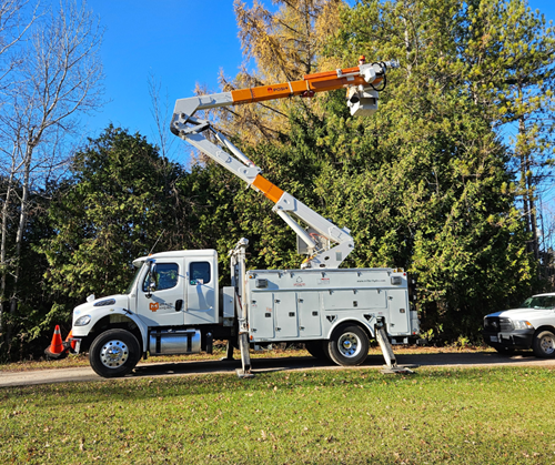 Image showing retrofitted bucket truck with arm extended